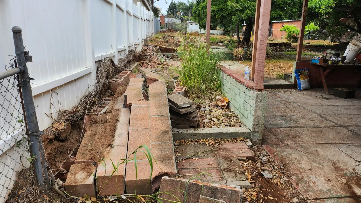 Block retaining wall and walkway before removal