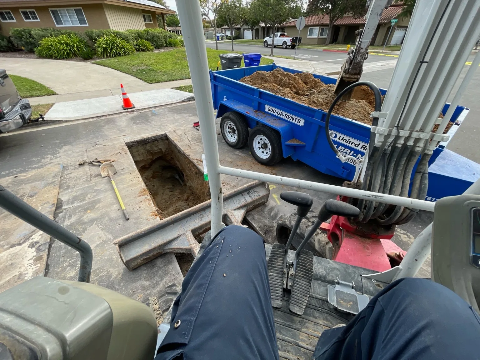 Excavator and spoil handling at roadway utility repair