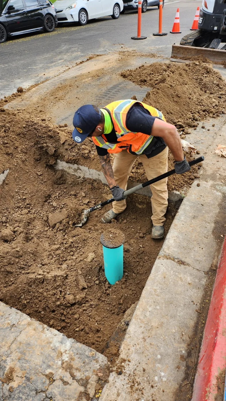 Backfill activity around excavated valve work site
