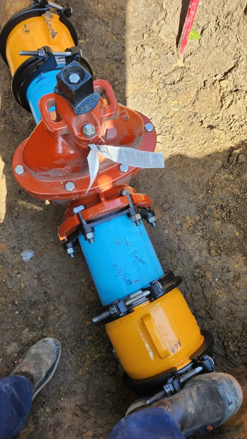 Close view of replacement water valve and couplings